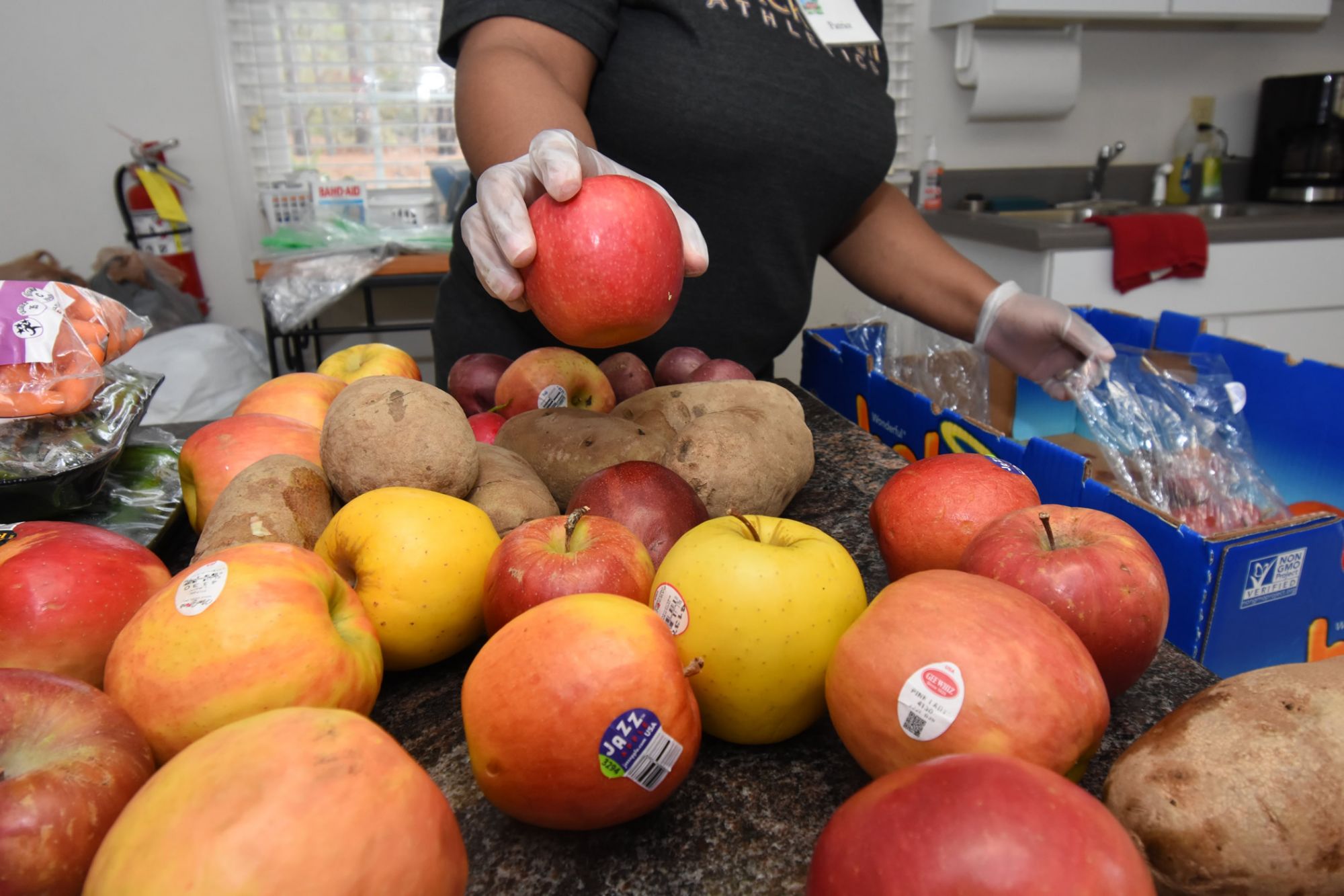 Woman handing out apples